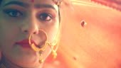 Indoor close-up 4k video of an Asian/Indian beautiful Hindu bride...