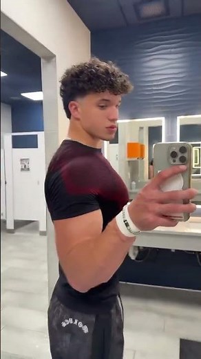 Handsome college hunk flexing