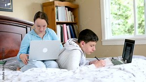 Vidéo Stock Two caucasian children watching something funny on laptop. Attractive brunette boy pointing his hand on screen. Pretty little girl laughing from what she see on computer. High quality
