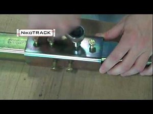 Track Joints and Suspensions for Overhead Conveyor Systems