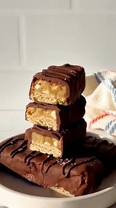 Comment RECIPE below and we'll send it! This is our protein Snickers bar recipe, made with nutritious ingredients such as oat flour, peanut butter, maple syrup, and protein powder. https://fitfoodiefinds.com/snickers-protein-bar-recipe/ healthy snacks | healthy desserts | fit foodie finds | Fit Foodie Finds