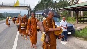 Making merit by giving alms round to the Buddhist monks | Global Buddhist Foundation