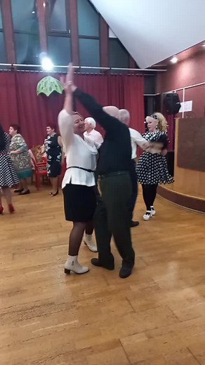 Social Dance Fun: Adults Enjoying a Vibrant Dance Party