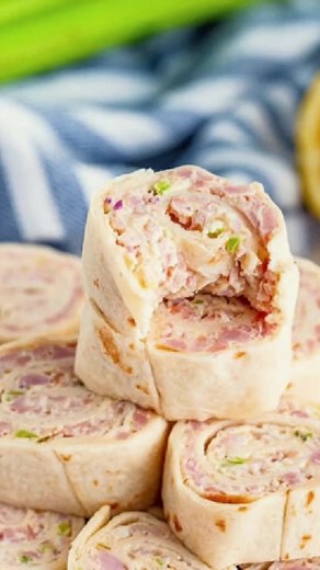 Ham Salad Pinwheels are simple to make and pack a punch of delicious flavor that everyone loves. Ham salad wraps are the perfect party appetizer or finger food and can be made for any occasion. #appetizer #ham #hamandcheese #party #snack #hamsalad #salad | Kevin & Amanda