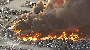 Car junkyard fire in Texas sends huge plume of black smoke into air