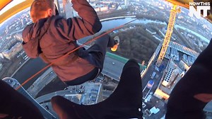 These guys are dangling from a crane, hundreds of feet in the air, for fun | NowThis