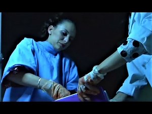 evil nurses in latex gloves harvest organs