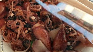 Firefly Hotaru ika squid Japanese seasonal seafood from Toyama Japan marinated in pack Stock Video