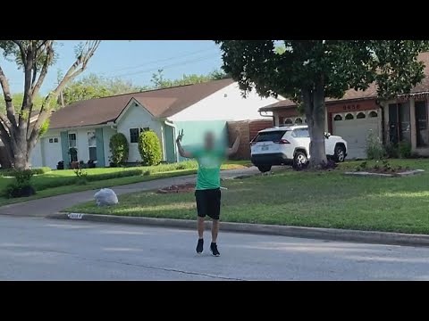 Man caught on video yelling racial slurs at biracial couple walking down the street