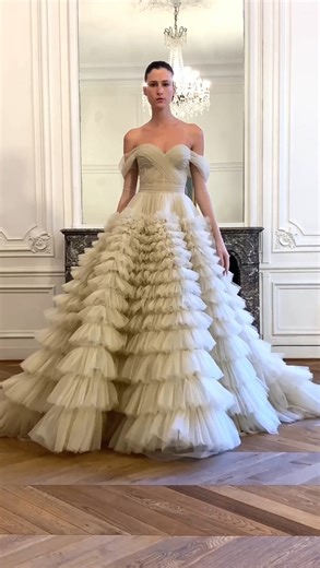 KATHARINA / This immaculate #ZuhairMurad off-shoulder princess wedding dress features a beautiful draped corset bodice with a statement tiered ruffle skirt and detachable sleeves.🌷🌷🌷 https://bit.ly/3I6DUWF #zuhairmuradbridal #weddingdress #hkwedding #bridal #婚紗 | Designer Bridal Room, Hong Kong