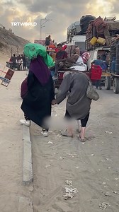 13K views · 772 reactions | An elderly Palestinian couple was displaced from Gaza City and fleeing toward southern Gaza on foot, carrying their belongings, following intensified Israeli attacks and evacuation orders in northern Gaza. | TRT World | Facebook