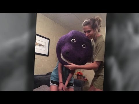 Teenage girl gets head stuck in Barney mask