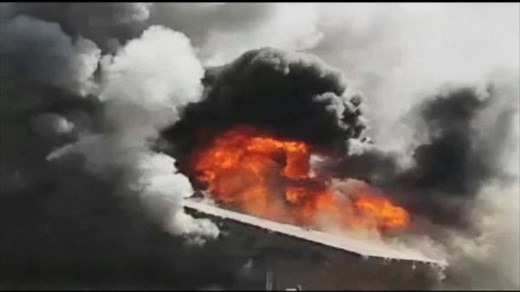 Firefighter's Dangerous Fall Into Fire Caught on Video