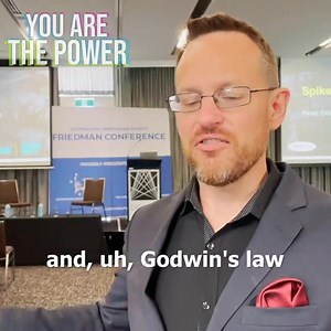 When I was at the Friedman Conference in Sydney, protesters showed up with...a very weird accusation about us. | Spike Cohen