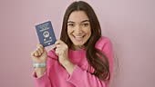 Joyful young hispanic woman flaunting hong kong passport, looking all...