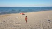 Afro italian woman enjoying summer at the beach