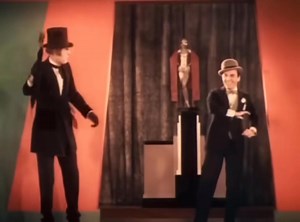 Serene turns saucy in 1930, as Earth’s lost sheep crank up the heat—ditching prim ingenue cover-ups for leggy Jazz Age flapper frippery en route to “The Devil’s Cabaret”, MGM’s pre-Code lark of the same year. Lured by the slick sales patter of Satan’s smooth-talking fixer, the aptly named Mr. Burns (Eddie Buzzell), they hoof and harmonize their way to perdition, with Herbert Stothart and Howard Johnson’s 1930 tune, “Come Hot It Up With Me,” setting the tempo. | O'Neal de los Trinos