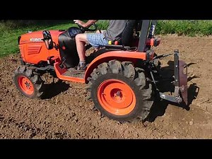 Kubota B2420 with a subsoiler.