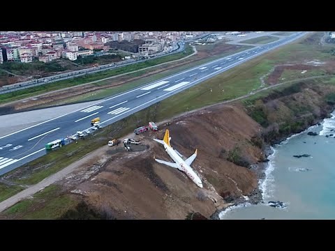 Footage shows plane stuck on cliff edge after skidding off runway in Turkey