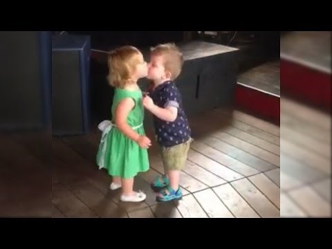 Adorable First Kiss Between Cute Baby Girl and Baby Boy