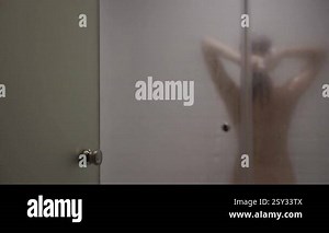 Shower stall. A woman is washing herself in the shower Stock Video Footage - Alamy