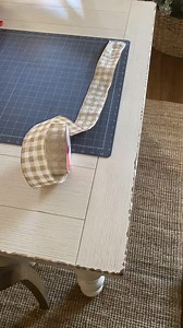 How to add ribbon to your pencil tree. Cut your ribbon into 12 and 18 inch strips. This uses less than a roll of 2.5 inch ribbon. Saves you time and money. I even had ribbon left over to use on another project. #christmasdiy #diychristmas #penciltree #blogmas #seasonaldecor #mybhg #madforplaid #christmasdecor #christmastree #buffaloplaid #buffalocheck #buffalocheckchristmas #christmastreedecorating #bhgholiday #imsocrafty #abmholidayspirit #craftersofinstagram #handmadechristmas #crazy4christmas