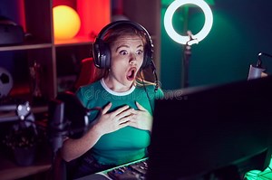 Redhead Woman Playing Video Games Scared and Amazed with Open Mouth for Surprise, Disbelief Face Stock Photo - Image of scared, surprise: 287847272