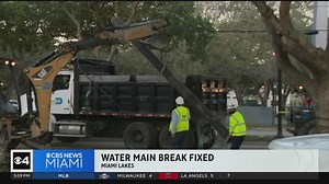 A water main break that flooded a Miami Lakes street on Monday, and caused a sinkhole, has been fixed and the road has re-opened. | CBS Miami | Facebook