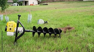 The drilled ground. The land hole. Borer for the fence installation. Bore tool. Portable manual earth auger for prepare the soil for planting shrubs or trees. High quality 4K footage