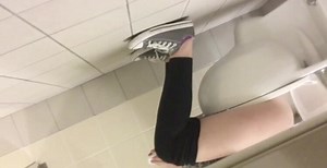 Girl sitting on the toilet