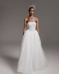 This renaissance-style #VeraWangBride wedding dress features a strapless corset bodice bathed in cascades of 3D lace appliques detailing with a dramatic princess skirt and pick-up folds on the back. https://bit.ly/3M8yDk6 | Designer Bridal Room, Hong Kong | Facebook