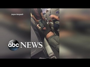 Man dragged off flight by law enforcement after not giving up seat