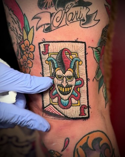 Joker Card Patch Tattoo by Sacred Hand Tattoo Society