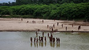 Rare images show the uncontacted Mashco Piro tribe in the Peruvian Amazon. Advocacy groups say the tribe is being seen more often as they look for food away from logging activities. | USA TODAY Video