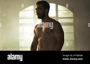 Handsome Shirtless Man with Naked Muscular Torso with Visible Six Pack Stands Resting after Bodybuilding Exercise. He's in the Middle of Abandoned Factory Building Stock Video Footage - Alamy