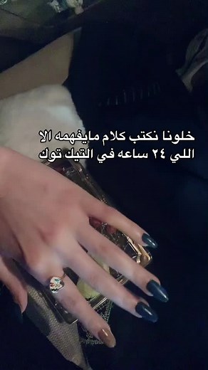 Beautiful Hand with Dark Blue Nail Polish and Fruits