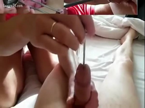 Guy has wife shove different objects into his cock hole