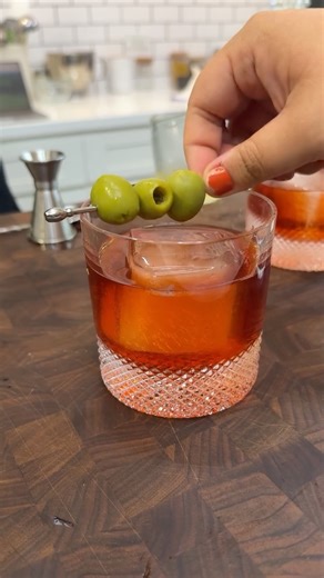 @kelli_epicurie loves a good Negroni—there’s even a graphic poster of one in her living room. She's also a fan of the current trend among bartenders of giving a savory spin to sweet and bitter cocktails. So, naturally she tried—and loved—the dirty Negroni. Her recipe for the cocktail brings together gin, Campari, sweet vermouth, a splash of olive brine, and a garnish of buttery Castelvetrano olives for a drink that's perfect for when you can’t decide between a martini and a Negroni. Get the reci