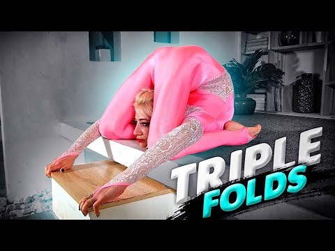 Stretching with partner. Triplefold training. Contortion routines in photostudio. Flexshow