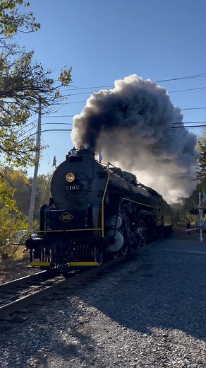 Reading and Northern 2102 rounds the bend at Bellemans Church Rd, north of Leesport, PA, throwing up a big plume of steam in the brisk morning air. The big steam engine was pulling the fall foliage special from Reading to Jim Thorpe and back yesterday, 10/19/24. #steamtrain #steamlocomotive #steamengine #readingandnorthern2102 #fallfoliage #autumnvibes | Rail Brothers