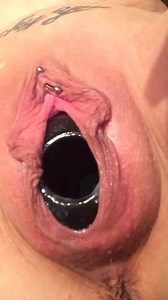 Whore birthing a large Kong toy