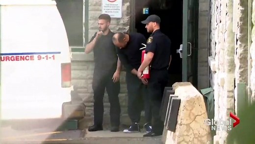 Quebec City police investigates after officer holds fire extinguisher while escorting suspect
