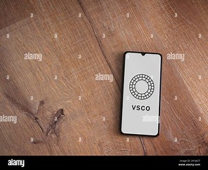 Lod, Israel - July 8, 2020: VSCO - Photo and Video Editor app launch screen with logo on the display of a black mobile smartphone on wooden background Stock Photo - Alamy