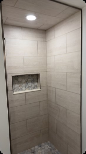 New addition for our customers cottage! Hexagon marble shower floor with 12x24 porcelain for the walls looks beautiful ! Also, 12x24 porcelain laundry room. #tile #tilework #remodel #bathroom #bathroomdesign #bathroomrenovation #laundryroom #porcelain #marble #showerideas | Daris Tile & Marble
