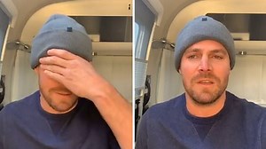 Stephen Amell goes shirtless while stringing lights on a tree