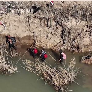 VIDEO — Drone camera footage taken Sunday shows migrants from Latin American countries walking along razor wire fence after crossing the Rio Grande river as they try to cross Texas border despite security measures | DAILY SABAH | Facebook