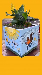 In more A2AC Planters news, Nicole Ray (@sloe_gin_fizz) has started her second planter across from her first on 4th Ave. Check back next week when she puts the final touches on them both. Repost @sloe_gin_fizz ・・・ I made a lot more progress on the second planter today — across the street from the first — with Squirrel out and about gathering letters, ideas and inspiration with his butterfly net in this original work commissioned by Literati Bookstore, in association with the Ann Arbor Art Center