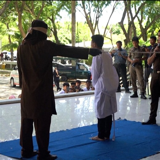 Two men were publicly flogged in Indonesia's Aceh province after a court operating under strict Islamic law found them guilty of sexual relations. Gay sex is outlawed in Aceh, which imposes a version of sharia, but it is not illegal elsewhere in the Muslim majority country. | DW News