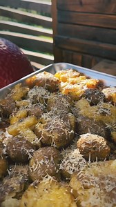 Smoked and smashed parmesan potatoes! How many are you grabbing? 📸 @feedingkiddswithfire | Masterbuilt
