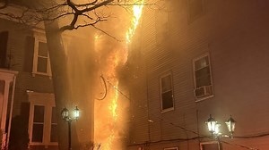 Firefighter Hurt, 15 People Displaced After Fire Spreads Among Roxbury Triple-Deckers